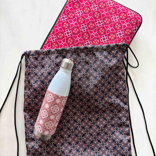 drawsting backpack with mosaic print in blue, purple and light pink